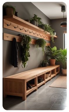 a wooden bench sitting next to a wall filled with potted plants