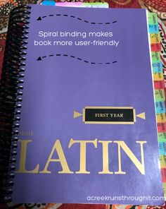 a purple book with the words latin on it