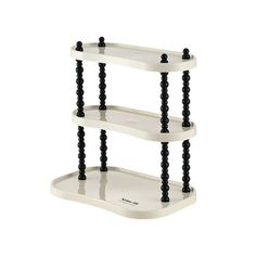 three tiered shelf with black beads on the bottom and white shelves below it, against a white background