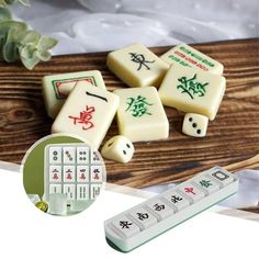 four dices with chinese writing on them and a remote control sitting next to it