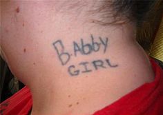 the back of a woman's neck with baby girl written on it in cursive font