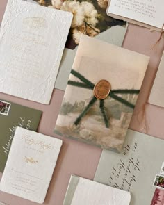 wedding stationery and envelopes laid out on a table