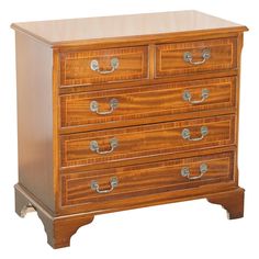 a wooden dresser with four drawers and two handles