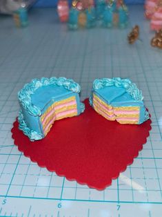 two pieces of cake sitting on top of a table