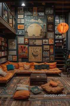 a living room filled with lots of furniture and books on the wall above it is an orange couch surrounded by pillows