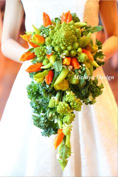 a bridal bouquet made up of broccoli, carrots and celery