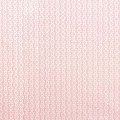 a pink and white background with small circles