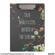 a clipboard with the words true beauty lies beneath the surface and flowers on it