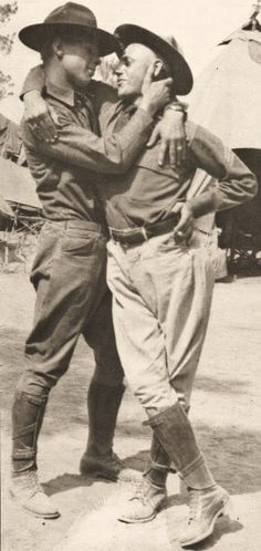 an old black and white photo of three boys