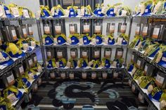 a room filled with lots of different types of bottles and containers on shelves next to each other