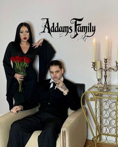 a man sitting next to a woman on a couch with roses in her lap and the words adam's family above them