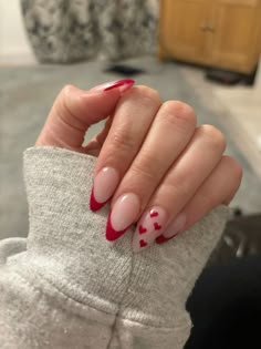 Red french with hearts on one nail✨ Trendy Nails Valentines Day, Christmas Nails Heart, Red Tip With Heart Nails, Red French Tip Nails Design, Red Nail Designs With Heart, Simple Red Nail Ideas, Heart Nails Red, Red French With Heart, Red Hoco Nail Ideas