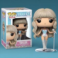 a pop vinyl figure is shown in front of a box with an image of taylor