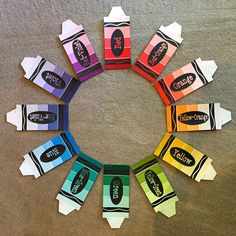 a circle made up of different colored candy wrappers