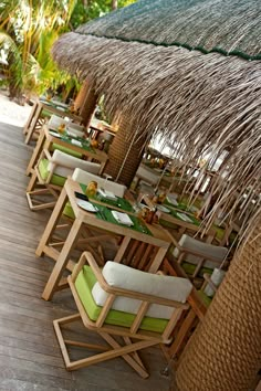 an outdoor dining area with tables and chairs