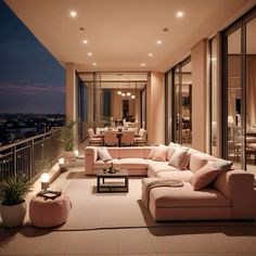 a living room filled with lots of furniture next to a window covered in glass doors