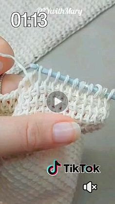 someone is crocheting an object with yarn