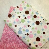 three pieces of fabric with different designs on them, one is pink and the other is green