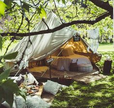 a tent is set up in the grass