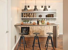 an open concept kitchen with bar stools