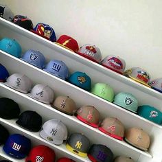 many hats are lined up on the shelves