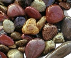 many different colored rocks and pebbles together