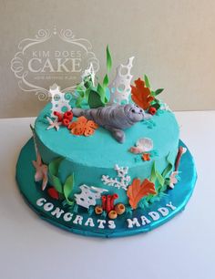 there is a blue cake with an animal on it