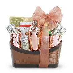 a gift basket filled with lots of different types of items and a bow on the top