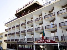 a hotel with balconies on the top floor