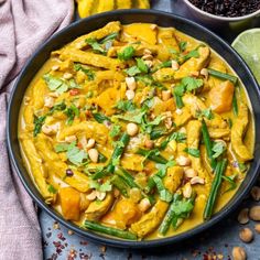 a bowl filled with yellow curry and vegetables