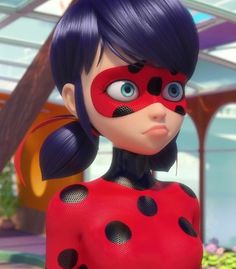 an animated ladybug girl with blue hair and black polka dots on her face