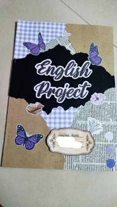 an old book with butterflies and the words english project on it