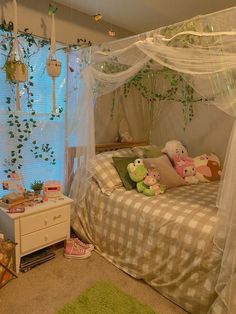 a bedroom with a canopy bed and green rugs