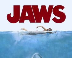 a movie poster for jaws with a woman swimming in the water