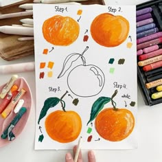 a child's drawing of an orange on paper with markers and crayons next to it