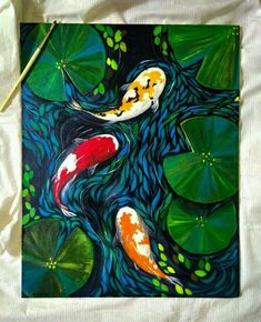 a painting of two koi fish swimming in water with lily pads on the ground