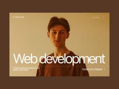 a man standing in front of a white wall with the words web development on it