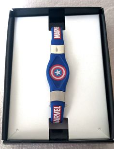 a watch in a box with the captain america logo on it