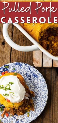 pulled pork casserole on a blue and white plate next to a serving dish