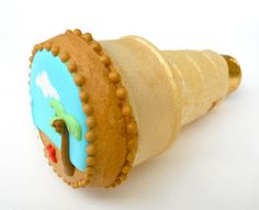 an ice cream cone with a cookie in the shape of a man riding a horse