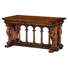 an ornate wooden table with columns and carvings on the top, against a white background