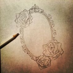 a drawing of a frame with two roses on it and a pencil in the foreground