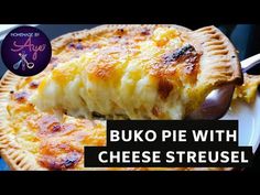 a piece of pie with cheese is on a white plate and the words, buko pie with cheese streusel