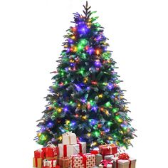 a brightly lit christmas tree with presents under it