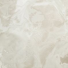 a white marble textured wallpaper that looks like it has been painted