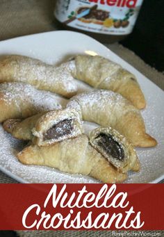 nutella croissants on a plate with powdered sugar