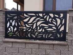 an iron screen on the side of a building