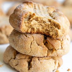 three cookies stacked on top of each other with one bite taken out of the cookie