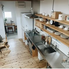 the kitchen is clean and ready to be used for cooking or baking, while also being used as a dining area