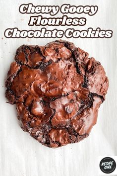 a chocolate cookie with the words chewy gooey flourless chocolate cookies on it